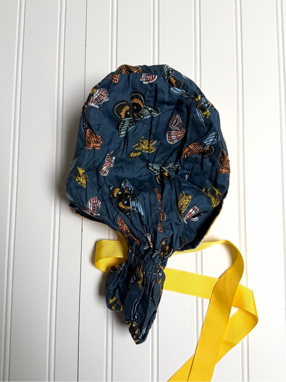 Kids Butterfly Print Bonnet in Navy with Yellow Tie